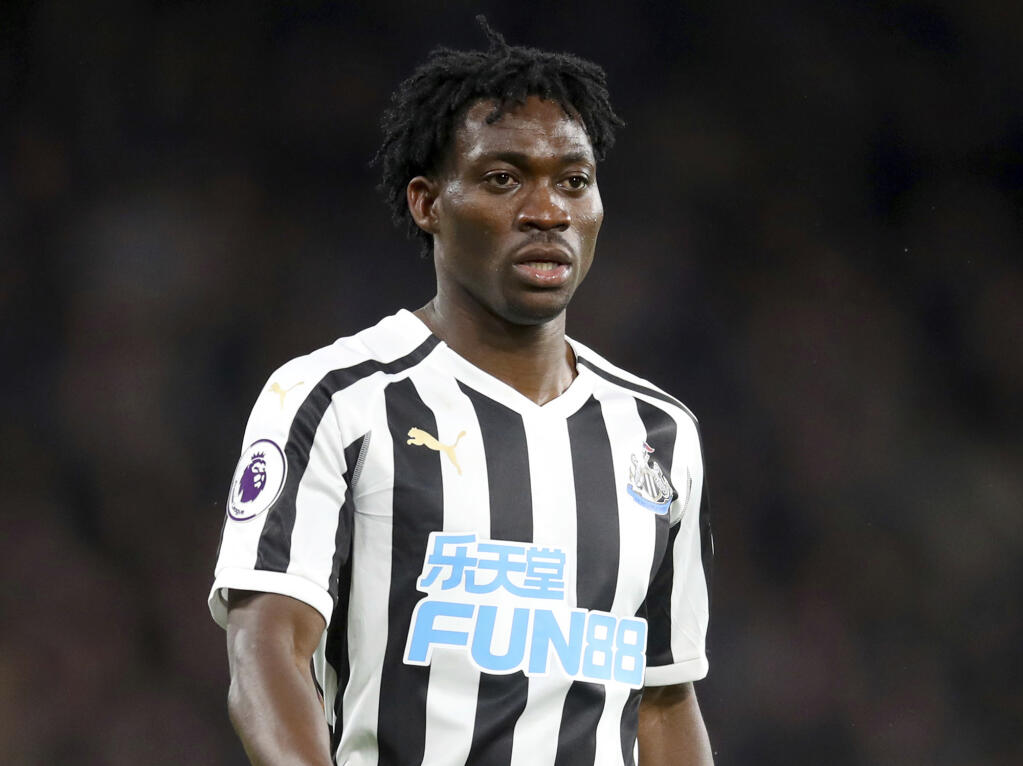 FILE - Christian Atsu looks on as he plays for Newcastle United, Jan. 12, 2019. Ghana international soccer player Christian Atsu is still missing after the earthquake in Turkey despite earlier reports that he had been rescued from the rubble of a collapsed building and taken to a hospital. Atsu's club and agent say they they haven't been able to confirm that the former Chelsea and Newcastle forward is at a hospital. Atsu plays for the Hatayspor club based in the southern Turkish city of Antakya. (Adam Davy/PA via AP, File)