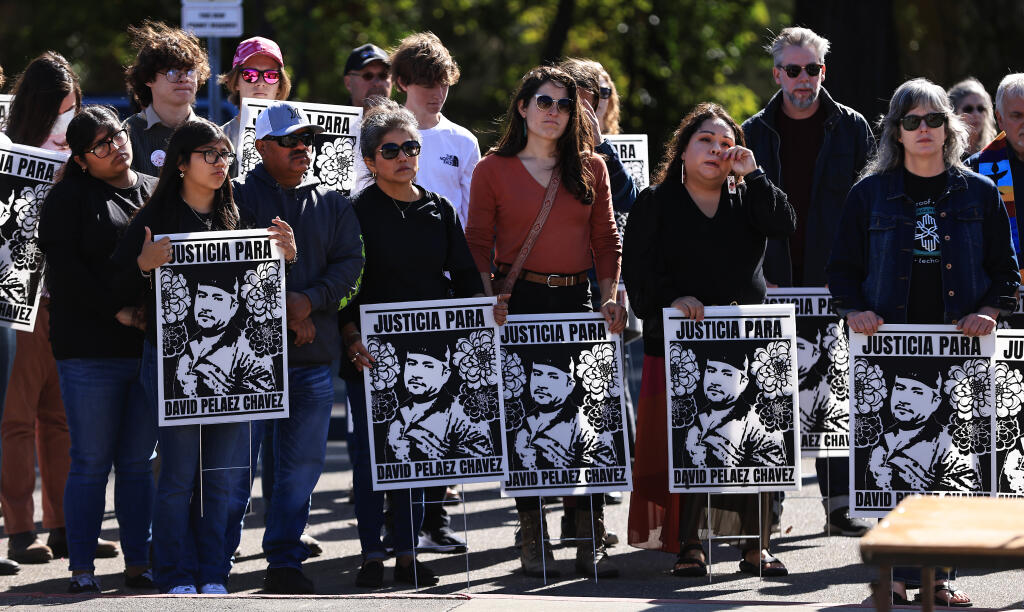 Relatives of David Pelaez-Chavez, including Yaranaxali Pelaez and brother Jose Pelaez, second and third from left, attend a rally, Saturday, Oct. 22, 2022, at the Sonoma County Administration Building in Santa Rosa. The rally was in part to acknowledge those victims of police brutality and misconduct. (Kent Porter / The Press Democrat file)