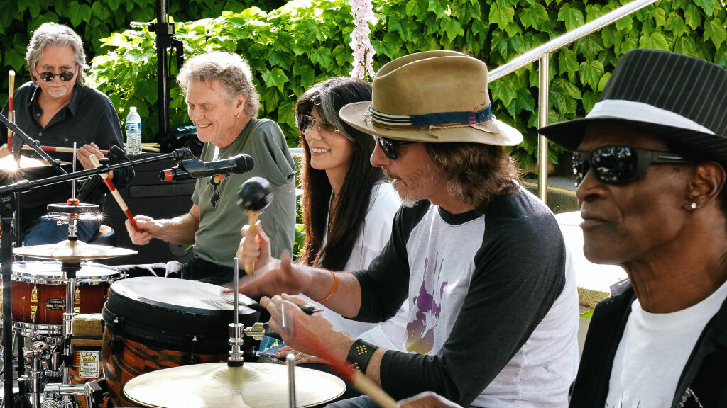 (From left) Todd Sucherman, Rick Allen, Lauren Monroe, Wally Ingram and Alvin Taylor perform during the Raven Drum Foundation drum circle for Tubbs Fire survivors and first responders at Chateau Diana in Healdsburg, Saturday, April 27, 2024. (Jordan Manning)