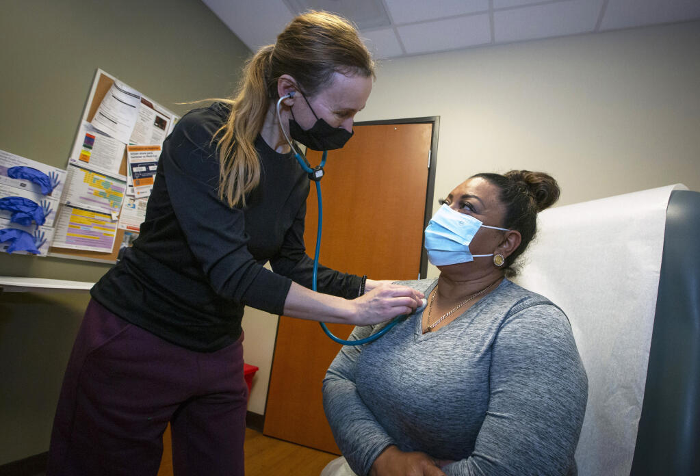 Nurse practitioner Irina Butorina listens to Sabina Rafaela’s lungs for signs of a respiratory infection at Sonoma Valley Community Health Center on Friday, Dec. 22, 2023. (Robbi Pengelly/Index-Tribune)