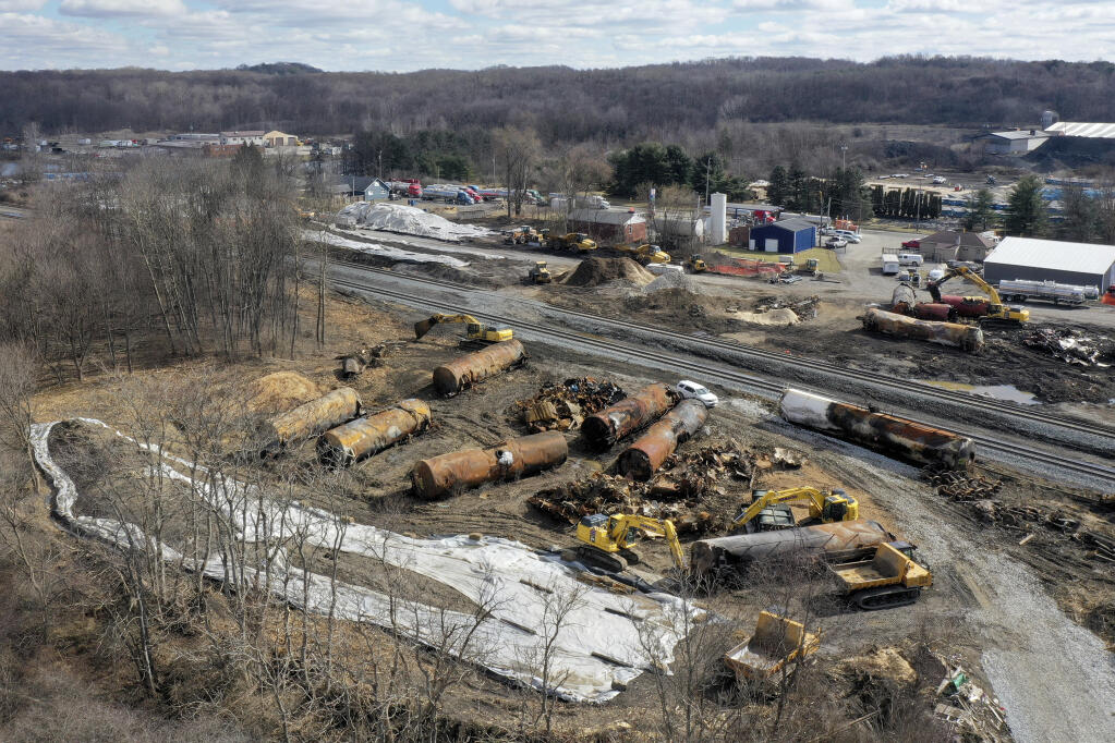 FILE - A view of the scene Feb. 24, 2023, as the cleanup continues at the site of a Norfolk Southern freight train derailment that happened on Feb. 3, in East Palestine, Ohio. The Ohio attorney general said Tuesday, March 14, that the state filed a lawsuit against railroad Norfolk Southern to make sure it pays for the cleanup and environmental damage caused by a fiery train derailment on the Ohio-Pennsylvania border last month. (AP Photo/Matt Freed, File)