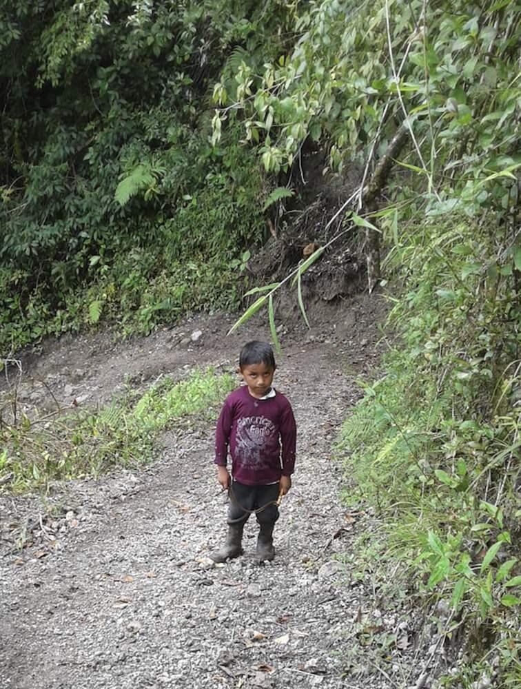 CORRECTS AGE - This undated photo provided by Catarina Gomez on Thursday, Dec. 27, 2018, shows her stepbrother Felipe Gomez Alonzo, 7, near Laguna Brava in Yalambojoch, Guatemala. Felipe died in U.S. custody at a New Mexico hospital on Christmas Eve after suffering a cough, vomiting and fever, authorities said. He was 8-years-old. The cause is under investigation. (Catarina Gomez via AP)
