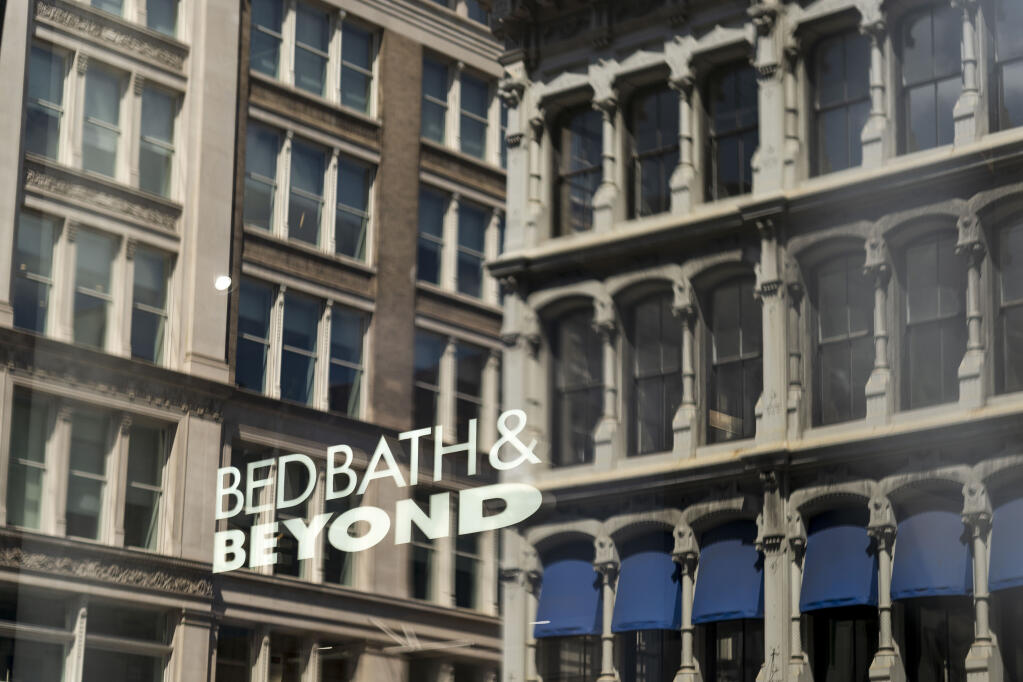 FILE — Bed Bath & Beyond sinage is seen through a window in New York, April 24, 2023. Overstock, which last week paid $21.5 million to acquire the bankrupt retailer’s intellectual property, said on Wednesday, June 28, that it would start operating its website under the Bed Bath & Beyond name. (Karsten Moran/The New York Times)