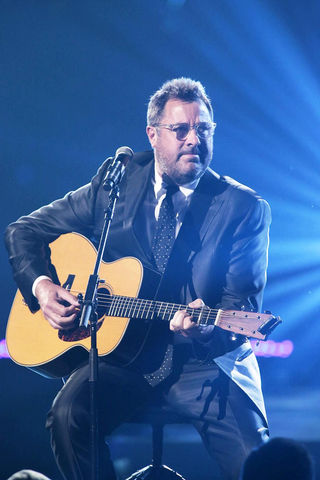 OKLAHOMA, OK - MAY 29: In this handout photo provided by NBC, Vince Gill performs during the Healing in the Heartland: Relief Benefit Concert held at the Chesapeake Arena on May 29, 2013 in Oklahoma City, Oklahoma. (Photo by Brett Deering/NBC via Getty Images) *** Local Caption *** Vince Gill