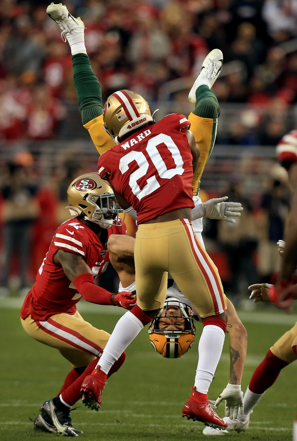 Jimmie Ward of the 49ers plants Allen Lazard of the Packers after a pass reception during San Francisco's 37-20 win over Green Bay in the NFC Championship game, Sunday, January 19, 2020 in Santa Clara. (Kent Porter / The Press Democrat) 2020