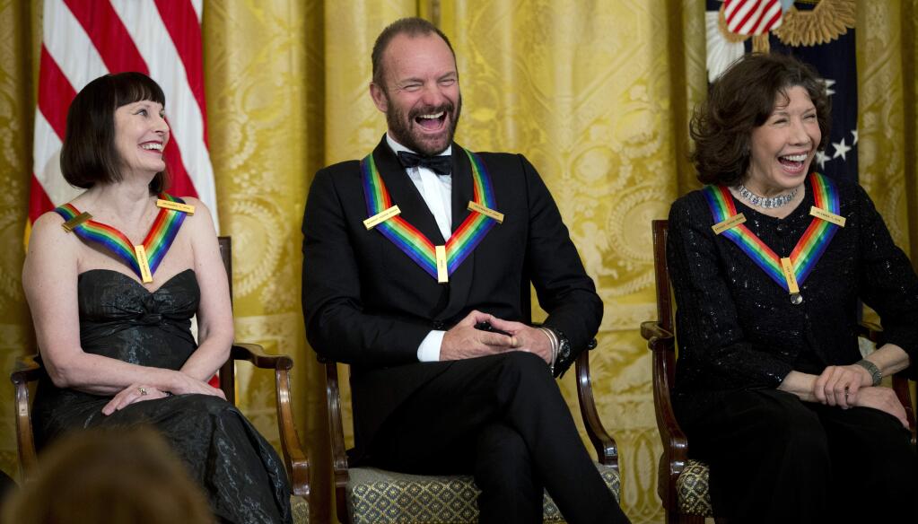 The Kennedy Center Honors Honorees ballerina Patricia McBride, from left, singer-songwriter Sting, and comedienne Lily Tomlin, laugh during a reception in their honor in the East Room of the White House in Washington, Sunday, Dec. 7, 2014, hosted by President Barack Obama and first lady Michelle Obama. (AP Photo/Manuel Balce Ceneta)