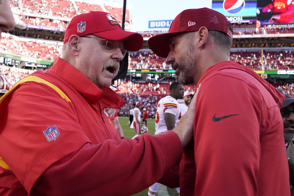 Kansas City Chiefs head coach Andy Reid, left, greets 49ers head coach Kyle Shanahan after their October game in Santa Clara. (Godofredo A. Vásquez / ASSOCIATED PRESS)