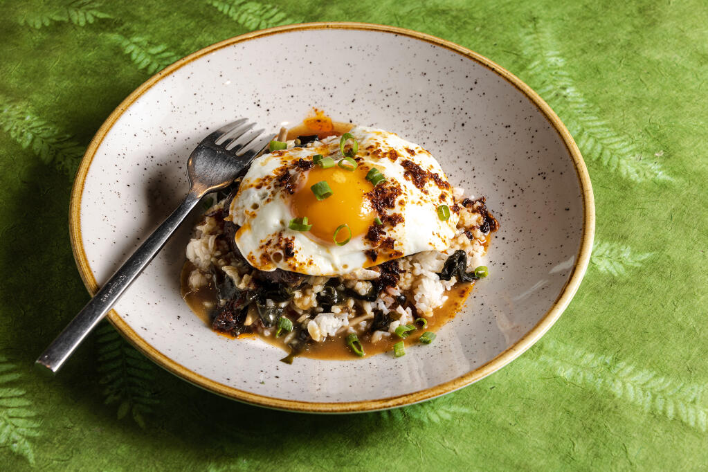 Loco Moco with seasoned beef patty, sunny side up egg, coconut rice, wakame, umami gravy and housemade chile crunch from the Lazeaway Club at the Flamingo Hotel in Santa Rosa, Tuesday, March 28, 2023. (John Burgess / The Press Democrat)