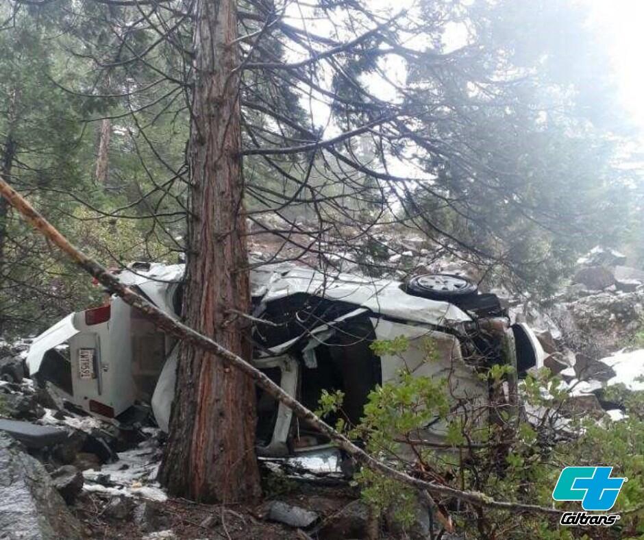 Mendocino County resident Tina Milberger’s car sits overturned down a 130-foot embankment along Highway 32 north east of Chico. Milberger and her dogs were rescued after CalTrans employees spotted tire tracks leaving the snowy roadway on Nov. 3. (CalTrans)