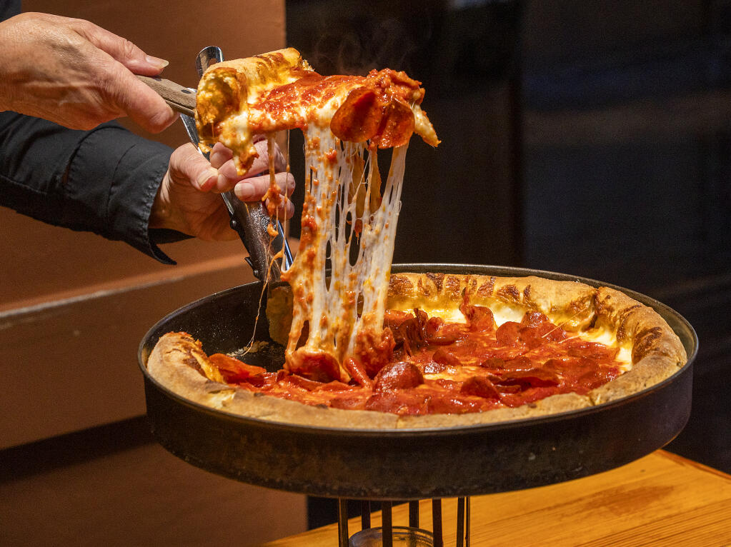The Double Crust Chicago-style pizza loaded with gooey cheese from Old Chicago Pizza in Petaluma on July 6, 2022. (John Burgess / The Press Democrat)