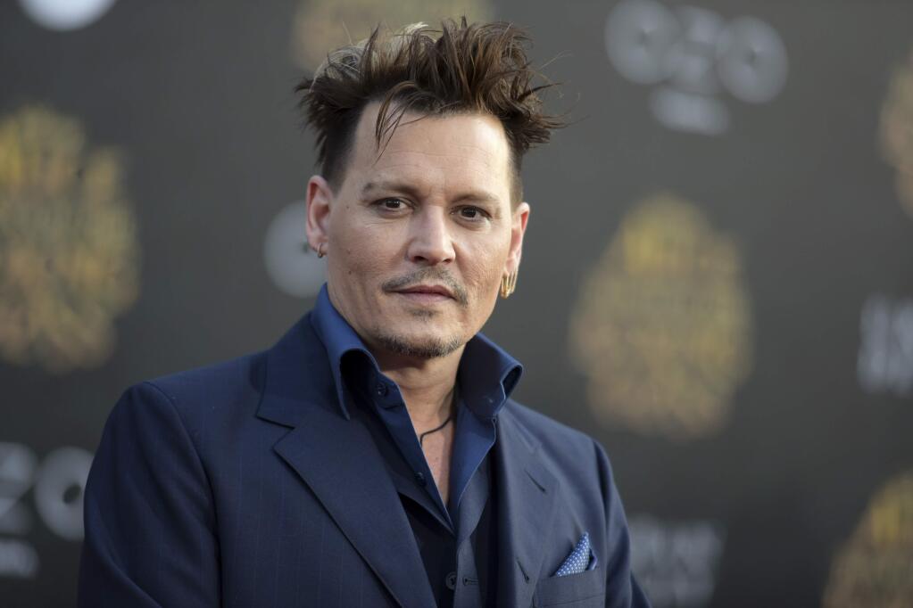 FILE - In this May 23, 2016 file photo, Johnny Depp arrives at the premiere of 'Alice Through the Looking Glass' at the El Capitan Theatre, in Los Angeles. Depp's former business managers countersued the actor on Tuesday, Jan. 31, 2017, stating that they frequently advised him that his spending was out of control. Depp sued his former business managers earlier this month alleging they mismanaged his money. (Photo by Richard Shotwell/Invision/AP, File)