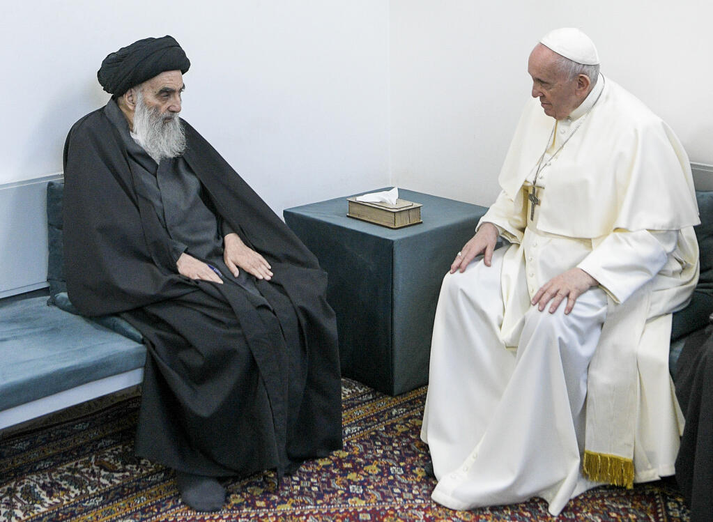 Pope Francis, right, meets with Iraq's leading Shiite cleric, Grand Ayatollah Ali al-Sistani in Najaf, Iraq, Saturday, March 6, 2021. The closed-door meeting was expected to touch on issues plaguing Iraq's Christian minority. Al-Sistani is a deeply revered figure in Shiite-majority Iraq and and his opinions on religious matters are sought by Shiites worldwide. (AP Photo/Vatican Media)