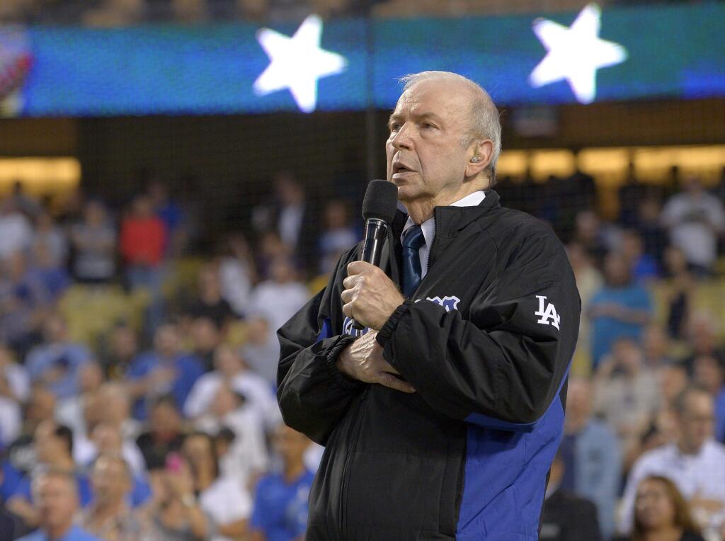 FILE - In this Sept. 18, 2015, file photo, Frank Sinatra, Jr. sings the national anthem prior to a baseball game between the Los Angeles Dodgers and the Pittsburgh Pirates in Los Angeles. Sinatra Jr., who carried on his famous father's legacy with his own music career, has died. He was 72. The Sinatra family said in a statement to The Associated Press that Sinatra died unexpectedly Wednesday, March 16, 2016, of cardiac arrest while on tour in Daytona Beach, Fla. (AP Photo/Mark J. Terrill)