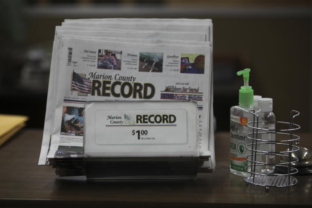 The last printed issue of the Marion County Record sits in a display in its office, Sunday, Aug. 13, 2023, in Marion, Kan. Editor and Publisher Eric Meyer says the newspaper will publish its regular weekly issue on Aug. 16, 2023, despite a raid by local law enforcement officers and the seizure of computers and cell phones. (AP Photo/John Hanna)