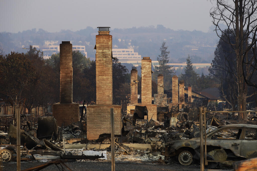 With the growing threat of wildfires, insurance companies are raising rates and in many cases canceling homeowners policies. (JAE C. HONG / Associated Press)