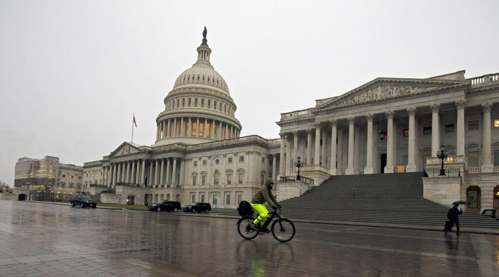 The U.S. Capitol is seen on a rainy day, Tuesday, Jan. 14, 2020, in Washington. (AP Photo/Jose Luis Magana)
