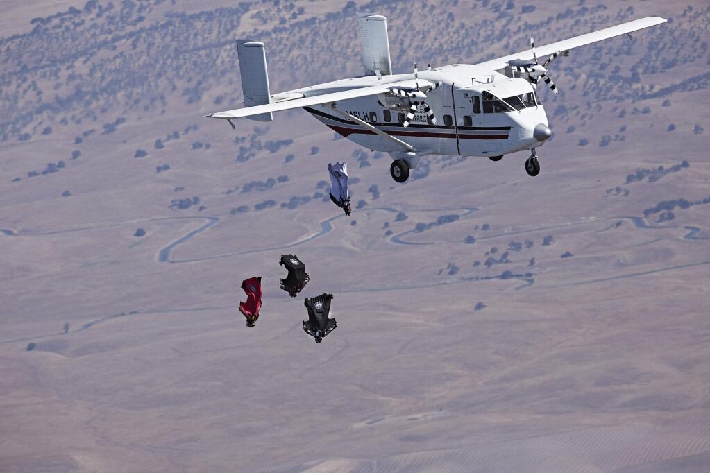 Wingsuit pilots compete during the Red Bull Aces wingsuit 4 cross race in Oakdale, California, on July 17, 2014. (Balazs Gardi/Red Bull Content Pool)