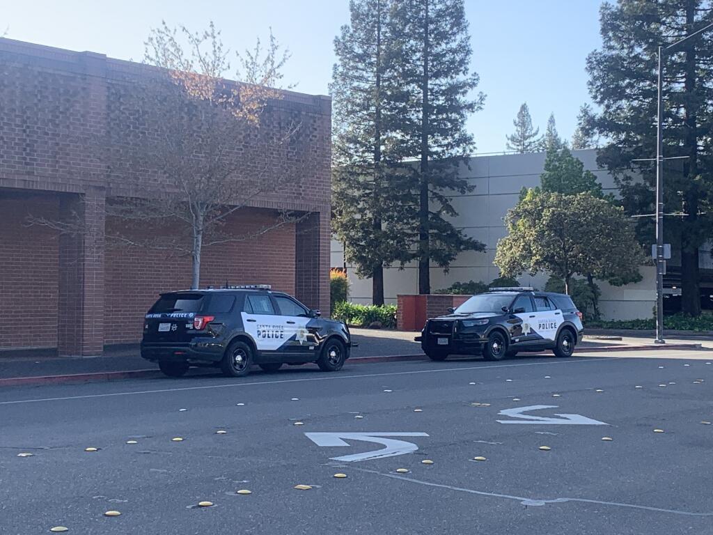 Santa Rosa police officers were at Santa Rosa Plaza after getting a report of someone with a gun Thursday, March 17, 2022. The suspect was a teenager with an airsoft gun. (Colin Atagi / The Press Democrat)