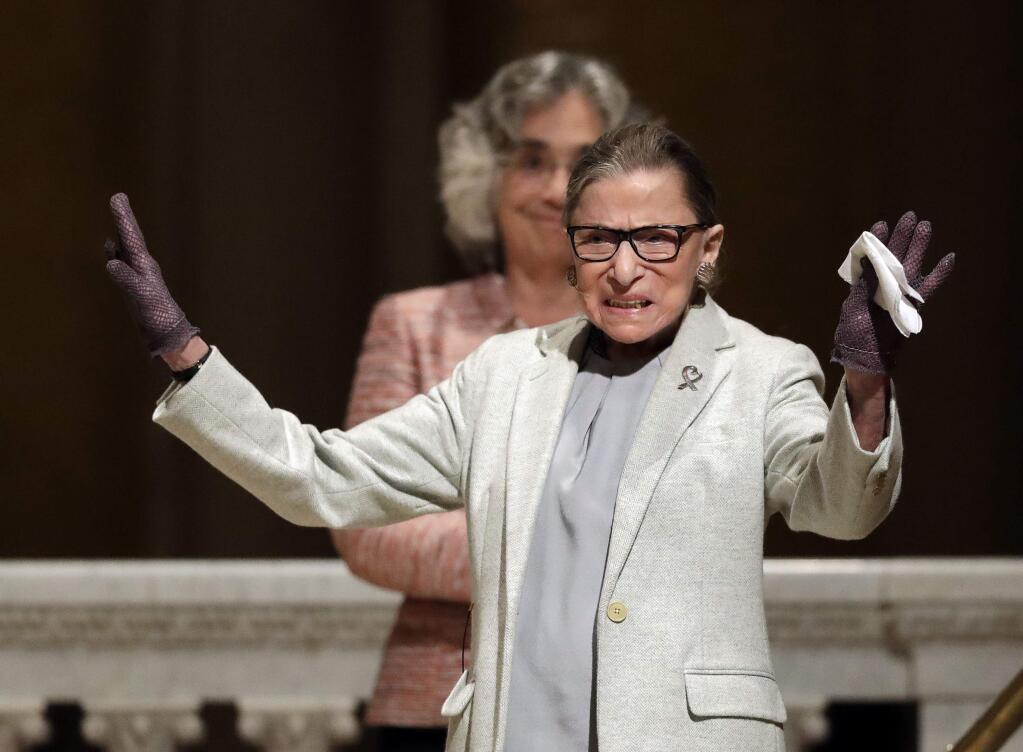 U.S. Supreme Court Justice Ruth Bader Ginsburg waves as she is introduced during a visit to Stanford University, Monday, Feb. 6, 2017, in Stanford, Calif. (AP Photo/Marcio Jose Sanchez)