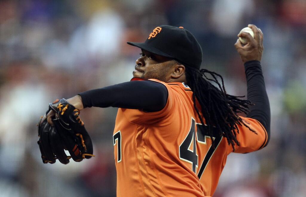 San Francisco Giants pitcher Johnny Cueto works against the New York Mets in the first inning Friday, Aug. 19, 2016, in San Francisco. (AP Photo/Ben Margot)
