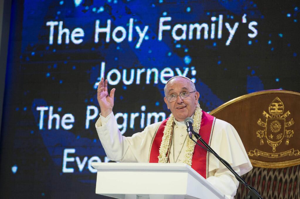 Pope Francis gives his speech during a meeting with families at the Mall of Asia arena in Manila, Philippines, Friday, Jan. 16, 2015. Walking into a packed 20,000-seat arena, Francis greeted and blessed the people who lined his long way to the stage. Pope Francis is on a five-day apostolic visit in this predominantly Catholic nation in Asia. (AP Photo/Osservatore Romano, Pool)