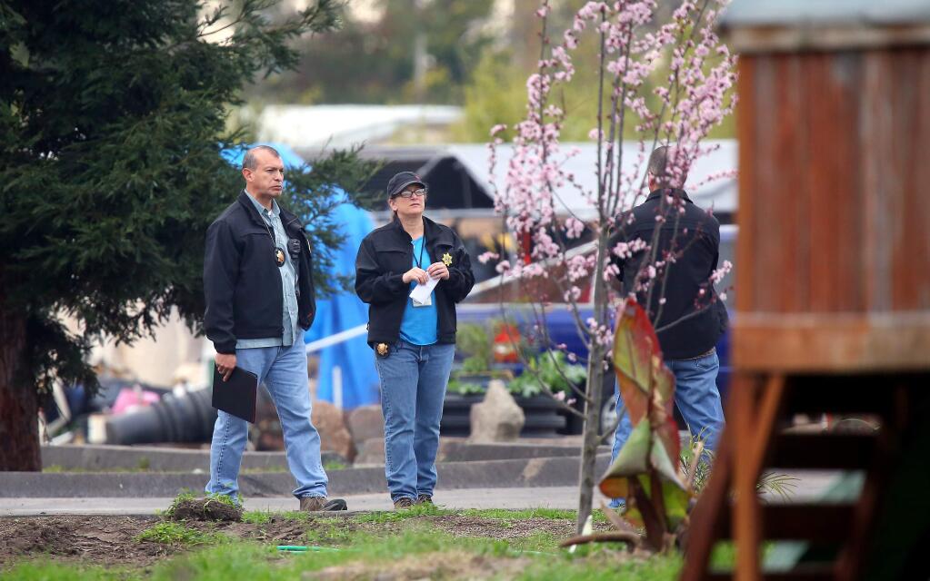 Law enforcement conduct an investigation at a property on Stony Point Road, north of Todd Road, in Santa Rosa on Thursday, Feb. 19, 2015. (CHRISTOPHER CHUNG/ PD)