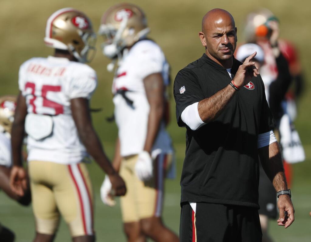 In this Aug. 17, 2019 file photo, San Francisco 49ers defensive coordinator Robert Saleh directs players during a combined training camp with the Denver Broncos at the Broncos' headquarters in Englewood, Colo. (AP Photo/David Zalubowski, File)
