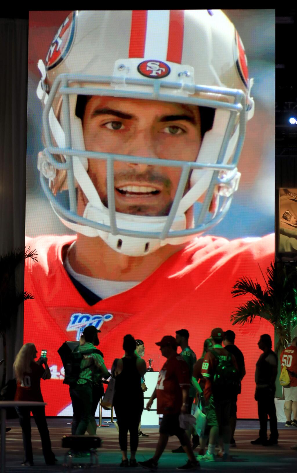 A larger than life video screen projects San Francisco quarterback Jimmy Garoppolo, Friday Jan. 31, 2020 in Miami Beach at the Super Bowl Experience. (Kent Porter / The Press Democrat) 2020