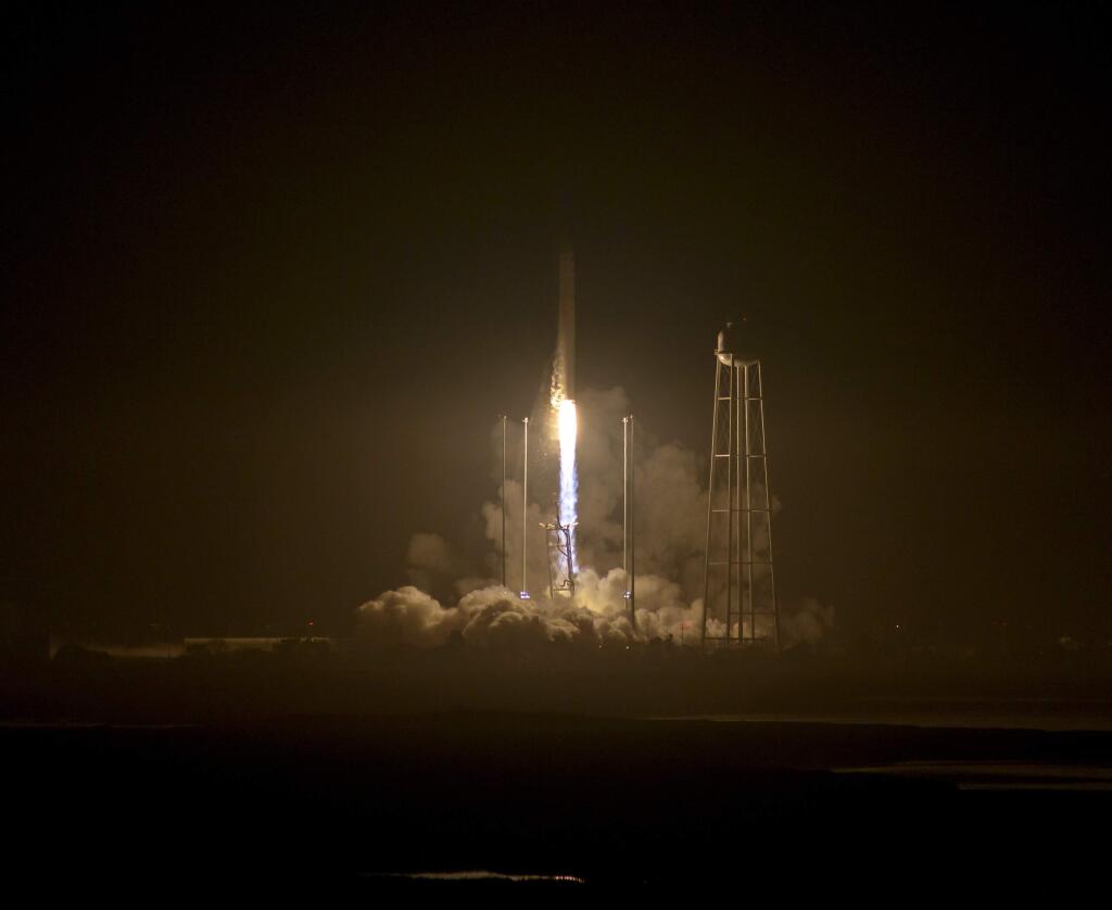 The Orbital ATK Antares rocket, with the Cygnus spacecraft onboard, launches from Pad-0A, Monday, Oct. 17, 2016 at NASA's Wallops Flight Facility in Wallops Island, Va. Orbital ATK's sixth contracted cargo resupply mission with NASA to the International Space Station is delivering over 5,000 pounds of science and research, crew supplies and vehicle hardware to the orbital laboratory and its crew. (Bill Ingalls/NASA via AP)