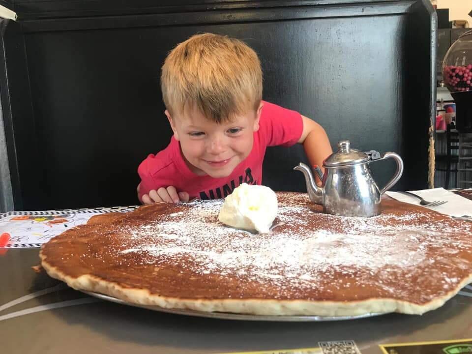 Erica Arent's son in pure delight after 'The Joint' arrives at the table. (PHOTO COURTESY OF ARENT FAMILY)