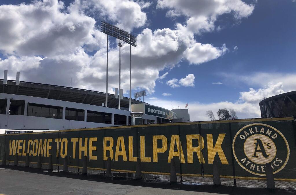 This March 25, 2020, file photo shows a banner to welcome to fans at the Oakland-Alameda County Coliseum in Oakland. (AP Photo/Ben Margot, File)