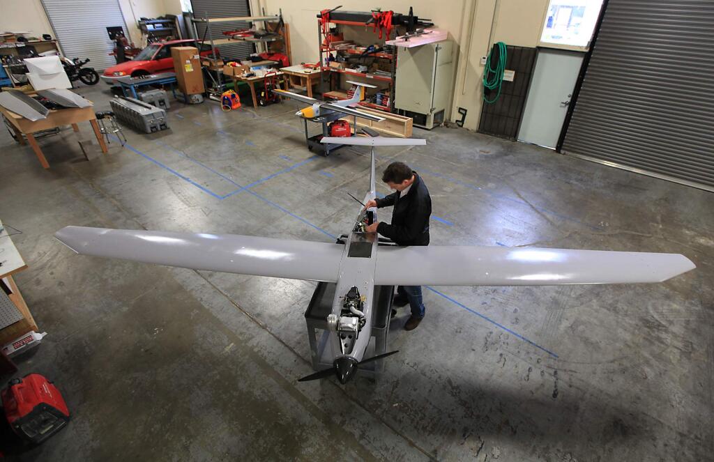 D'Milo Hallerberg, CEO of Arcturus UAV, checks the guidance system in one of his company's drone aircraft, Wednesday Jan. 27, 2010, in Rohnert Park. (Kent Porter / Press Democrat) 2010