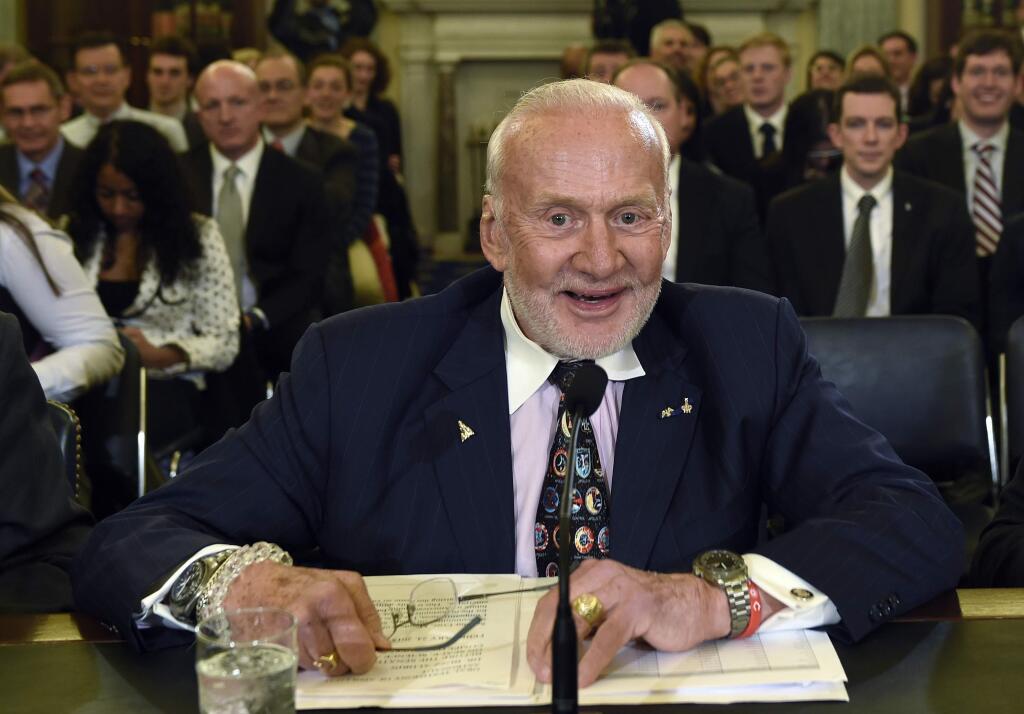 FILE - In this Tuesday, Feb. 24, 2015, file photo, Buzz Aldrin, former NASA Astronaut and Apollo 11 Pilot, prepares to testify on Capitol Hill in Washington, before the Senate subcommittee on Space, Science, and Competitiveness hearing on human exploration goals and commercial space competitiveness. Officials said Aldrin, one of the first men to walk on the moon, has been evacuated by plane from the South Pole for medical reasons. An association of Antarctica tour operators said Thursday, Dec. 1, 2016, that Aldrin was visiting the South Pole as part of a private tourist group when his health deteriorated. (AP Photo/Susan Walsh, File)