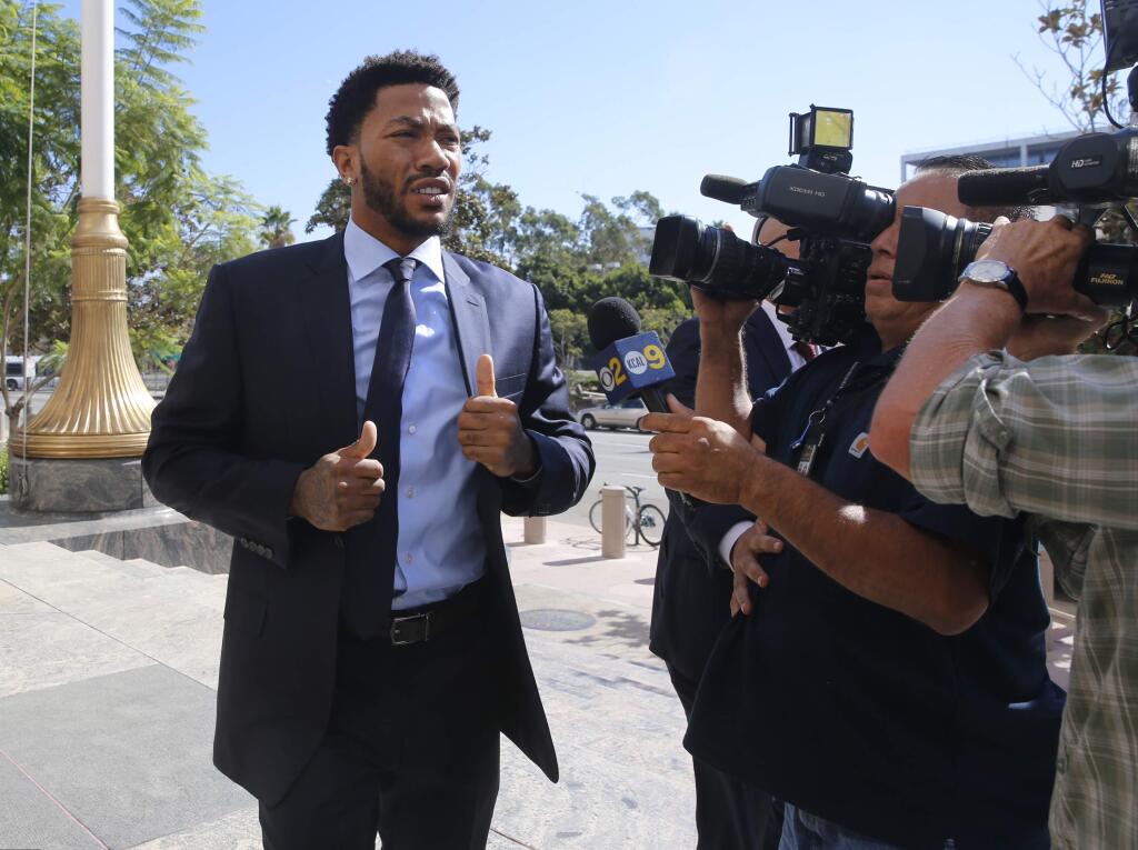 FILE - In this Thursday, Oct. 6, 2016, file photo, New York Knicks basketball player Derrick Rose arrives at U.S. District Court in downtown Los Angeles. NBA star Rose is set to return to the witness stand in a $21 million lawsuit that alleges he and two friends raped an incapacitated woman. Before Rose retakes the stand Tuesday, Oct. 11, a judge will consider a mistrial request from Rose's lawyer. (AP Photo/Damian Dovarganes, File)