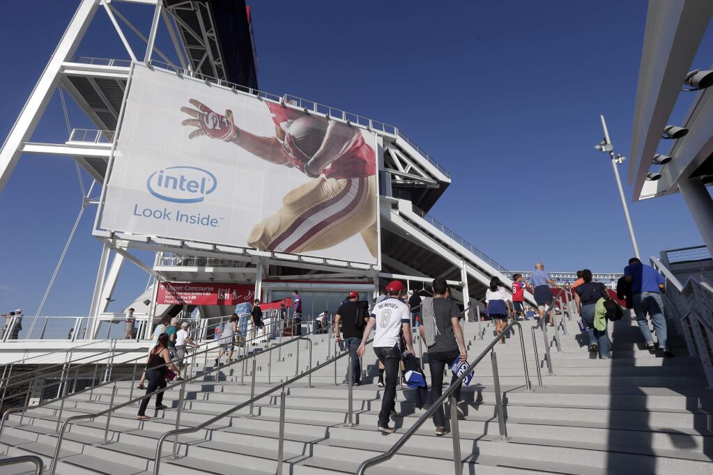 Fans enter the new Levi's Stadium before an MLS soccer match between the San Jose Earthquakes and the Seattle Sounders on Saturday, Aug. 2, 2014, in Santa Clara. (AP Photo/Marcio Jose Sanchez)