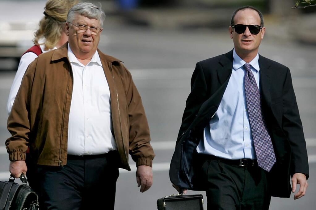 News/--Gary Armitage, left and bankruptcy attorney Russell Marne walk towards Federal Bankruptcy Court in Santa Rosa, Wednesday March 4, 2009 to answer questions of his assets. Behind him is wife Floy Nell Armitage. Armitage owned AGA Financial that collapsed last fall . (Kent Porter / The Press Democrat)2009