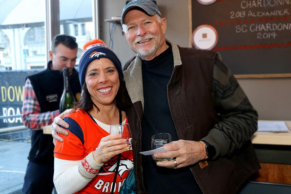 Karen and Greg Bauer of Livermore enjoy wine at the Taste of Sonoma lounge in the Super Bowl City fan mall in San Francisco on Jan. 31, 2016. Greg Bauer said they have been longtime wine club members of Robert Young Vineyards in Sonoma County's Alexander Valley. (Jeff Quackenbush / North Bay Business Journal)