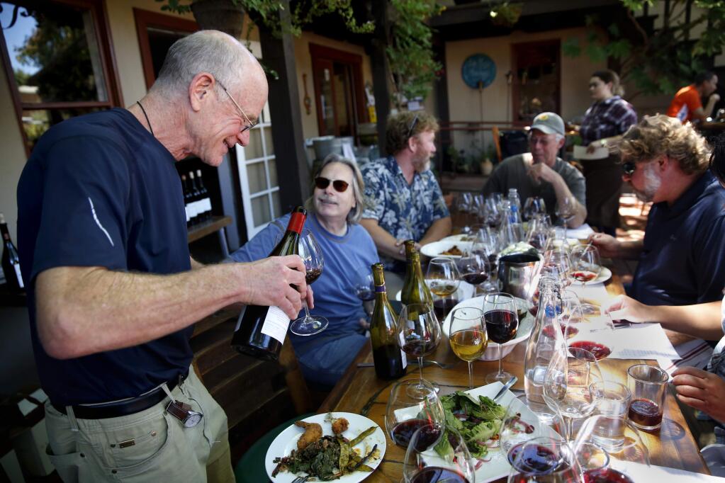 Dan Goldfield, Bob Cabral, Mike Sullivan, John Sims, and Jeff Stewart taste wines during a lunch for former colleagues from Hartford Court at Backyard in Forestville, Monday, July 11, 2016. (Beth Schlanker / The Press Democrat file)