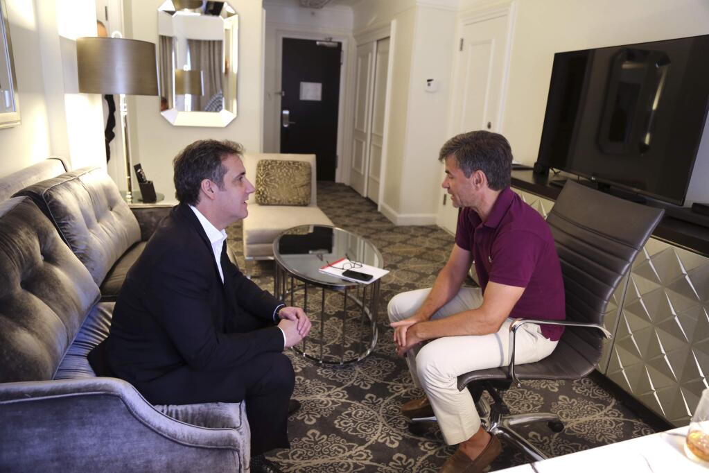 In this June 30, 2018, photo provided by ABC News, Michael Cohen, left, President Donald Trump's longtime personal lawyer and fixer, is interviewed by ABC's George Stephanopoulos during an off-camera interview in New York at the hotel where Cohen has been staying. In his first interview since federal agents raided his home and hotel room three months earlier as part of an investigation into his business dealings, Cohen made clear that protecting Trump is not his priority. 'My wife, my daughter and my son have my first loyalty and always will,' Cohen told Stephanopoulos, ''I put family and country first.' (ABC News via AP)