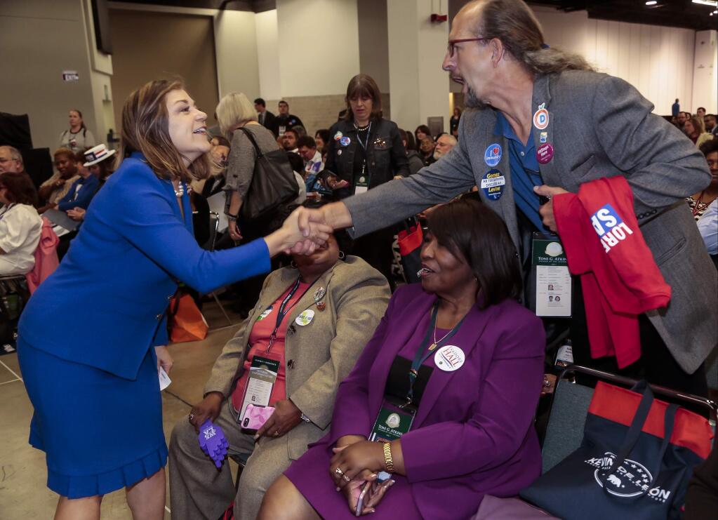 California Rep. Loretta Sanchez, left, greets supporters at the California Democrats State Convention in Anaheim, Calif., on Saturday, May 16, 2015. (AP Photo/Damian Dovarganes)