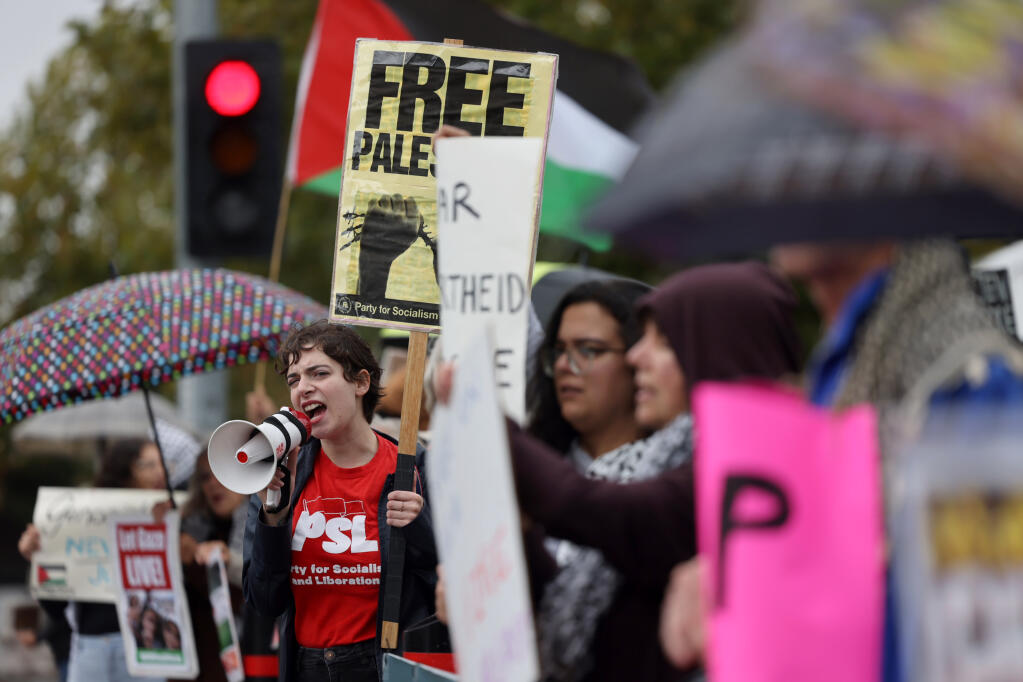 Supporters of Palestine attend a rally organized by individuals associated with Jewish Voice for Peace, and supported by the North Coast Coalition for Palestine, at Old Courthouse Square in Santa Rosa, Sunday, Oct. 22, 2023. (Beth Schlanker / The Press Democrat)