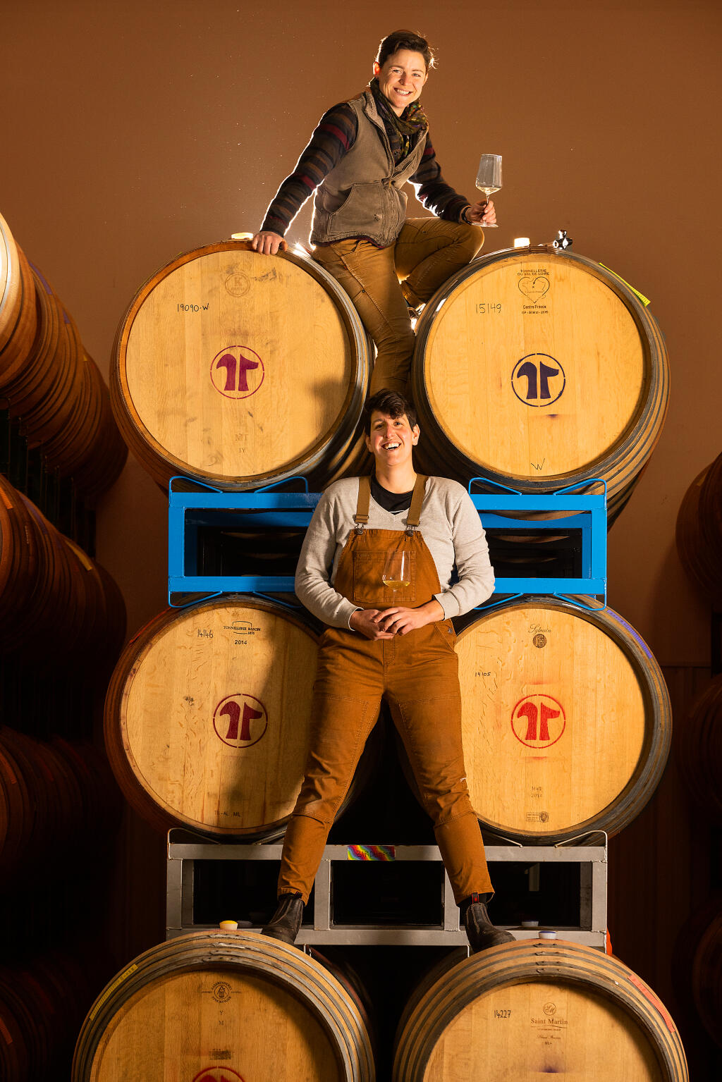 Katie Rouse, a winemaker with Bedrock Wine Co., top, and Corrine Rich, a winemaker with Scribe are life partners and partners in Birdhorse Wines, a small passion project produced in a Sonoma warehouse, Wednesday, Dec. 7, 2022. (John Burgess / The Press Democrat file)
