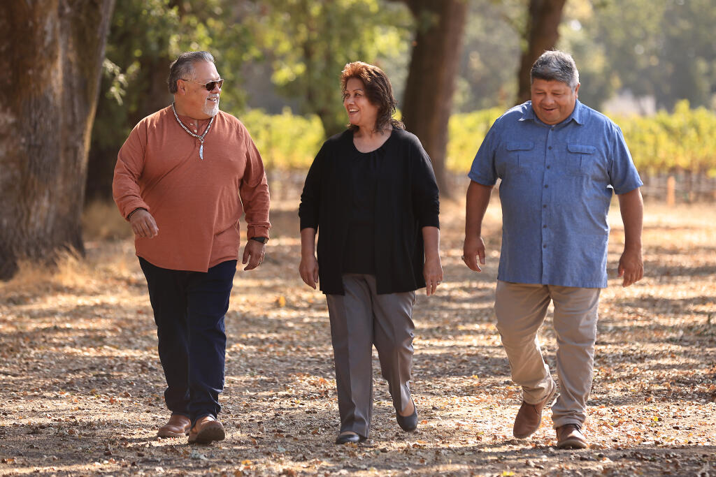 From left, Dino Beltran, Judy Fast Horse and Darin Beltran of Sonoma County's Native American Koi Nation, tour a portion of the 68 acres of land purchased by the tribe on East Shiloh Road, south of the Windsor town limit, where they plan to build a resort casino, Friday, Sept. 17, 2021.  (Kent Porter / The Press Democrat file)