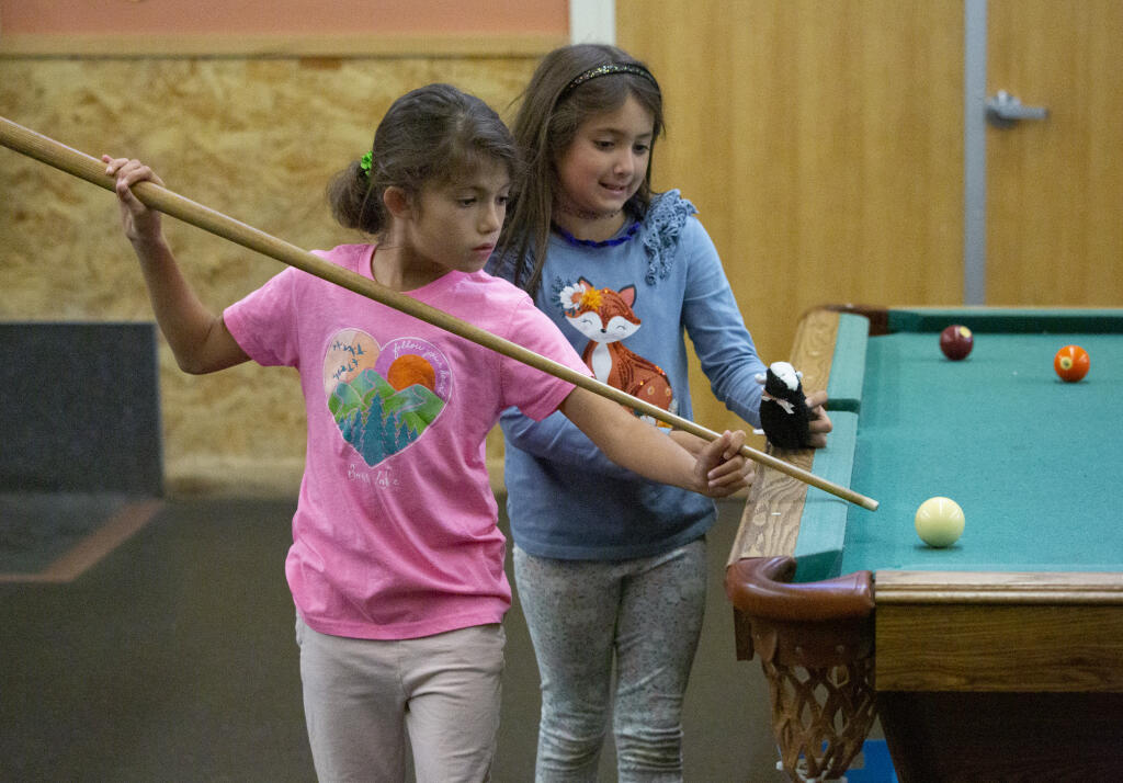 Members of the Boys & Girls Clubs of Sonoma Valley enjoy a game of pool during “open club,” a free period between the more structured classes, in the games room at the Maxwell Farms Regional Park location. Photo taken on Monday, Nov. 20, 2023. (Robbi Pengelly/Index-Tribune)