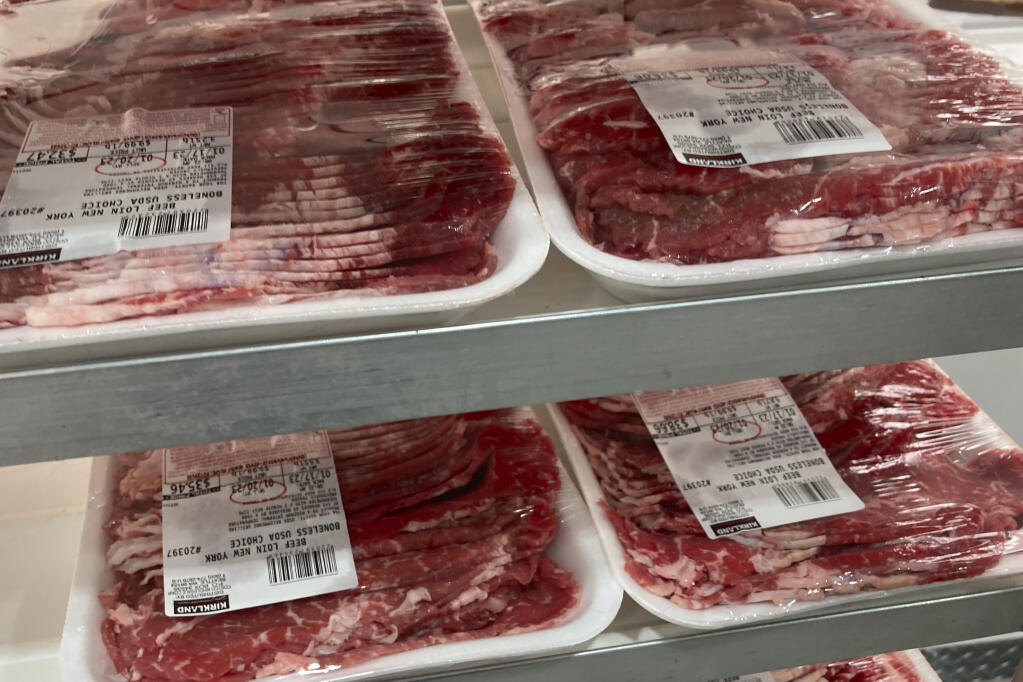 File - Packages of beef are prepared for display at a food store, Tuesday, Jan. 17, 2023, in North Miami, Fla. On Tuesday, the Labor Department reports on U.S. consumer prices for February. (AP Photo/Wilfredo Lee, File)