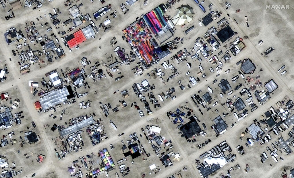 In this satellite photo provided by Maxar Technologies, an overview of Burning Man festival in Black Rock, Nev on Sunday, Aug. 27, 2023.  (©2023 Maxar Technologies via AP)
