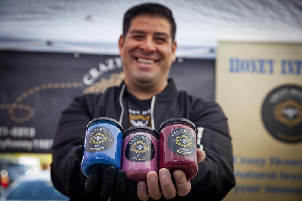 Raul Dominguez sells his uniquely flavored honey at the eastside Petaluma farmer’s market. His company, Crazy Honey, was born during the pandemic. Photographed on Tuesday, October 31, 2023._(CRISSY PASCUAL/ARGUS-COURIER STAFF)