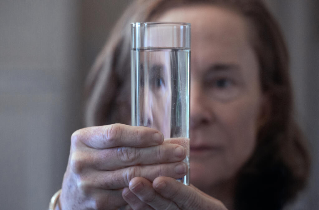 Nancy Cline with a glass of tap water from her home in Sonoma on Thursday, March 31, 2022. (Robbi Pengelly/Index-Tribune)