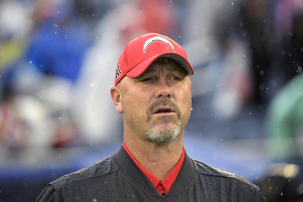 FILE - AFC defensive coordinator Gus Bradley, of the Los Angeles Chargers, watches during the first half of the NFL Pro Bowl football game against the NFC, in Orlando, Fla., in this Sunday, Jan. 27, 2019, file photo. The Las Vegas Raiders have hired Gus Bradley as their new defensive coordinator with the task of turning around one of the league's worst units. Coach Jon Gruden decided to bring on the experienced Bradley on Tuesday, Jan. 12, 2021, to fill that role Paul Guenther had for the first two-plus seasons on his staff before being fired in December. (AP Photo/Phelan M. Ebenhack, File)