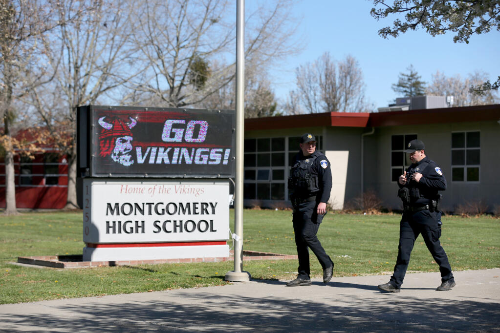 Santa Rosa Police Officers Jonathan Morgan, right, and Chris Rossi at Montgomery High School in Santa Rosa after a fight between students prompted a campus lockdown, Wednesday, March 1, 2023. (Beth Schlanker / The Press Democrat)